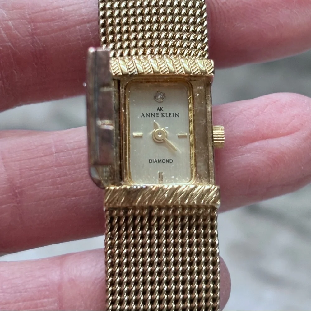 Anne Klein Diamond Collection Gold Tone Hidden Face Thin Strap Watch